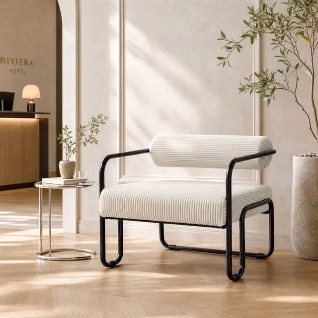 Poltrona lounge ULEVR in velluto a coste beige con struttura in metallo nero, portata 130 kg