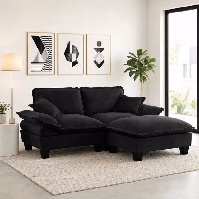 Divano angolare reversibile MIVRAY in tessuto nero con ottomana coordinata e cuscini inclusi, L/P/H: 194 x 155 x 90 cm