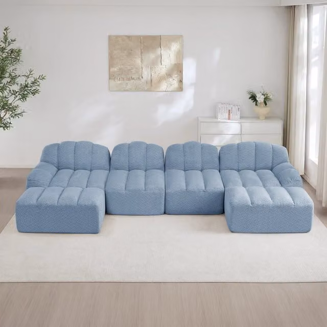 Divano angolare modulare OKWISH a 4 posti con 2 pouf, design moderno in tessuto blu per soggiorno