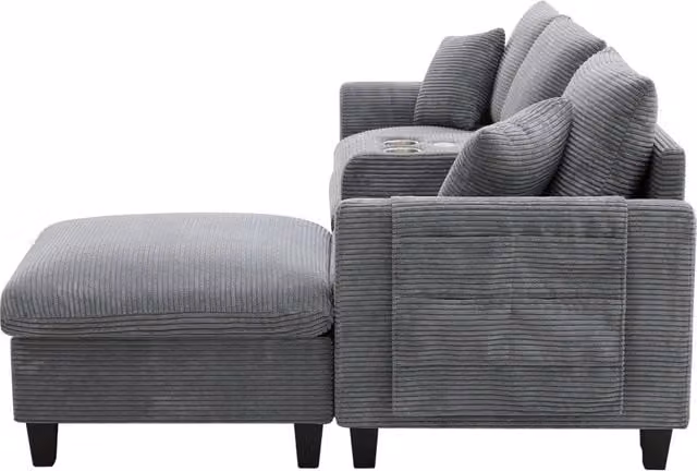 Divano angolare moderno a L in tessuto vellutato con consolle, portabicchieri, porte USB, tasche laterali e pouf contenitore, 4 posti