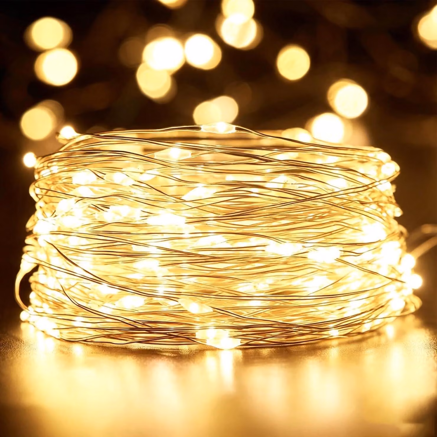 Catena luminosa da 10 metri, con 100 LED, alimentata a batteria, luce bianco caldo, filo di rame