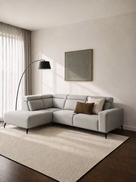 Divano angolare sinistro Calary Kenay Home colore perla con funzione letto e cuscini inclusi
