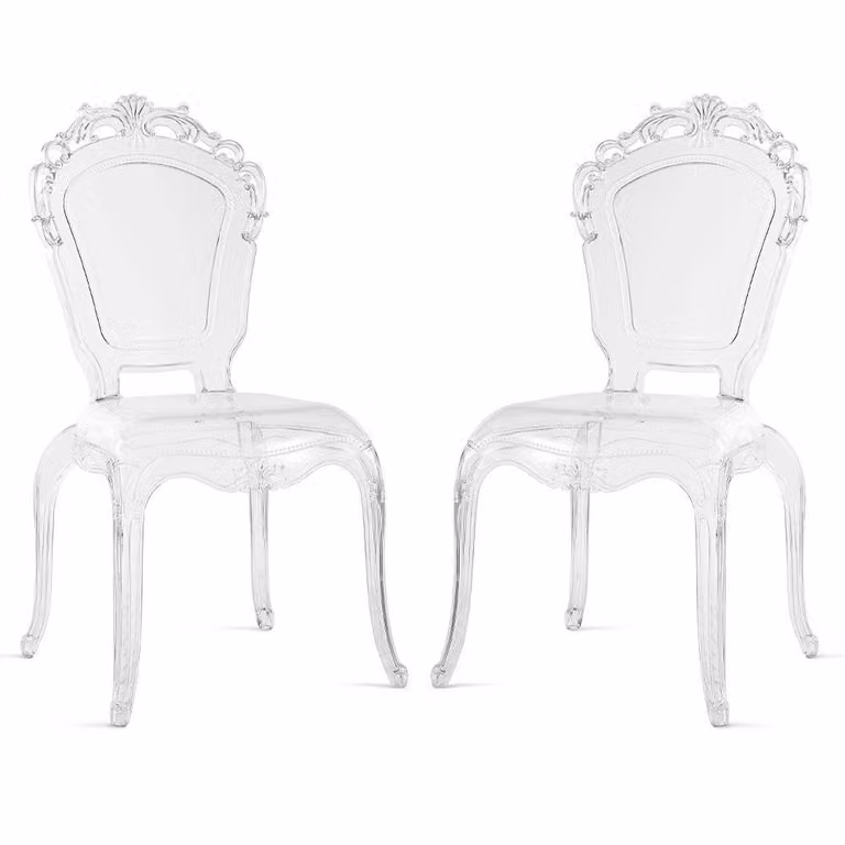 Set di 2 sedie impilabili in policarbonato trasparente, in stile barocco moderno, con piedini antiscivolo, adatte per interni, aree esterne coperte,da pranzo e ristoranti. Modello Maya/Trasparente