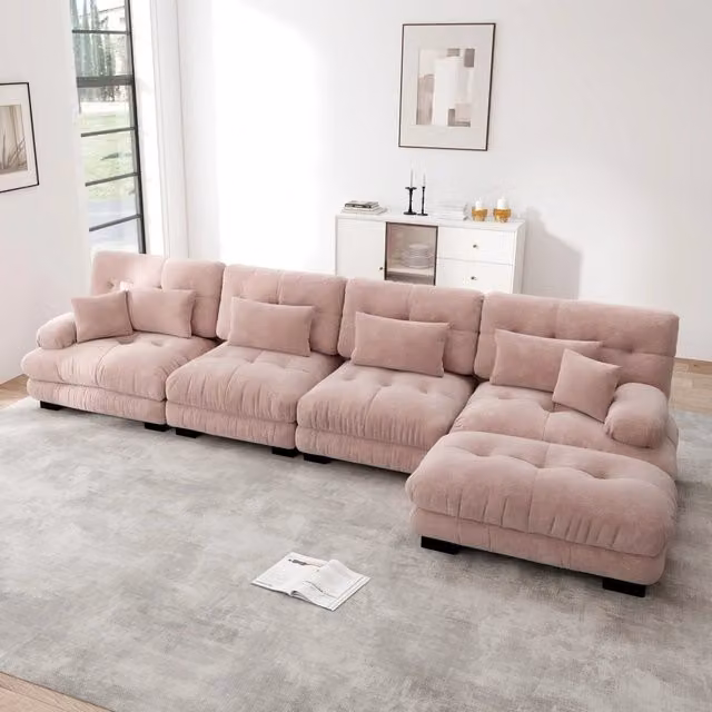 Divano angolare modulare MIVRAY in velluto rosa con pouf coordinato, configurabile a L o a U per il tuo soggiorno moderno