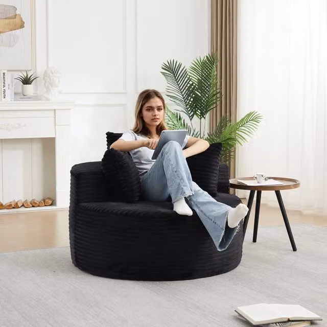 Poltrona lounge rotonda WISHDOR in velluto a coste nero con braccioli e design minimalista