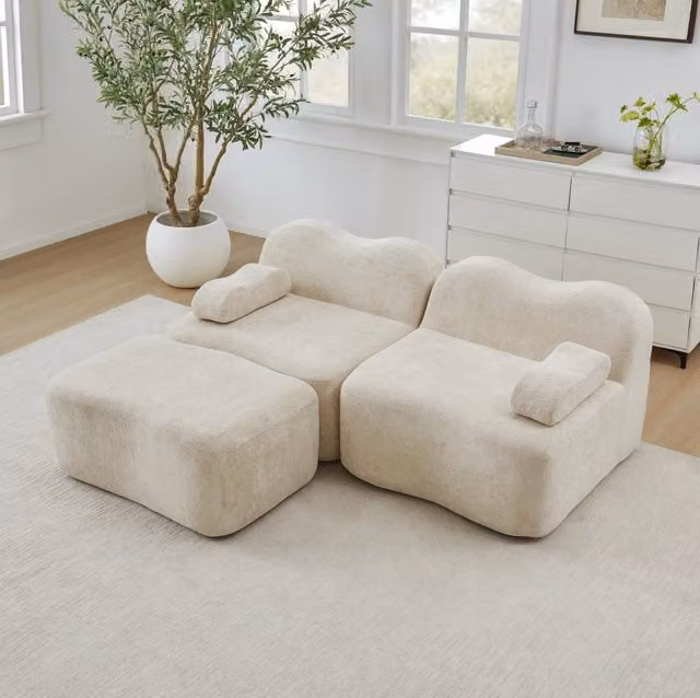 Divano angolare modulare senza telaio in velluto beige con pouf collegabile