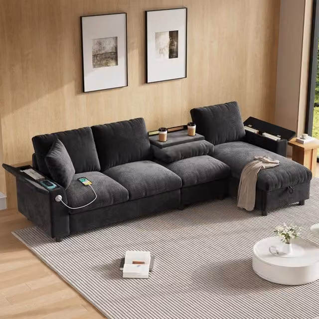 Divano angolare reversibile a L 280x137x84 cm con contenitori integrati; tavolino ribaltabile; portabicchieri; USB e USB-C; ciniglia; grigio