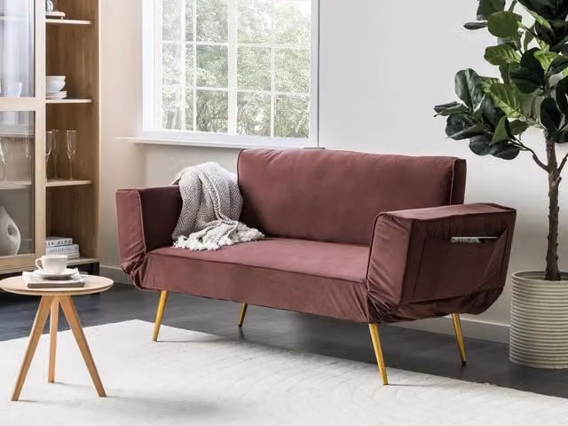 Divano letto click clack Beliani in velluto rosa con poggiatesta regolabile e coperture rimovibili per soggiorno L/P/H: 187 x 82 x 75 cm, superficie letto: 90 x 190 cm – 1