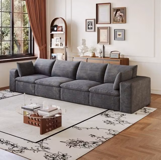 Divano modulare in tessuto grigio scuro con supporto in schiuma; design componibile