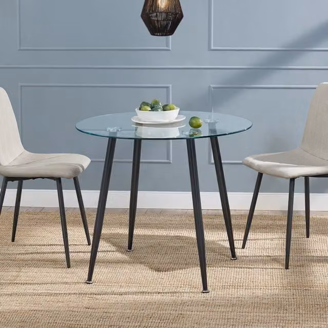Tavolo rotondo moderno Humppila en.casa con piano in vetro trasparente e gambe in acciaio nero, Diametro: 87 cm, Altezza: 75 cm – 1