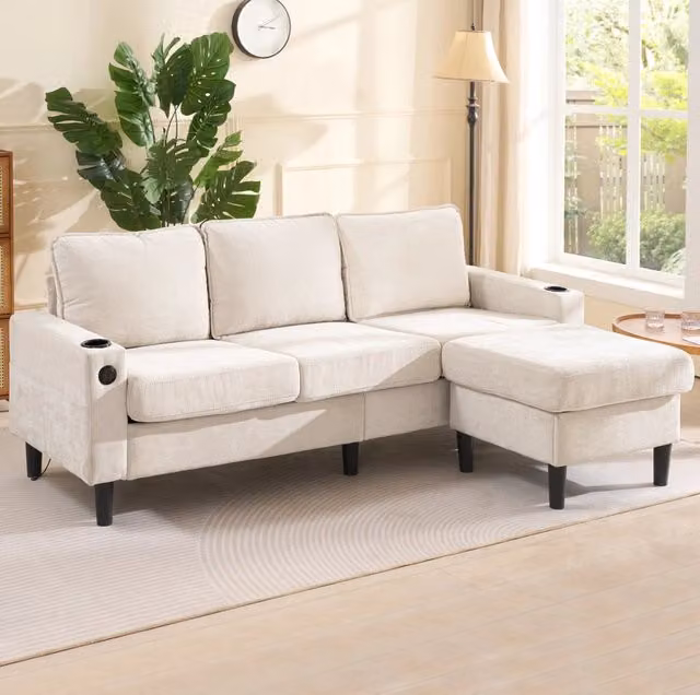 Divano angolare a L 202x137x80 cm in lino beige con porte USB e Type-C; portabicchieri e tasche laterali