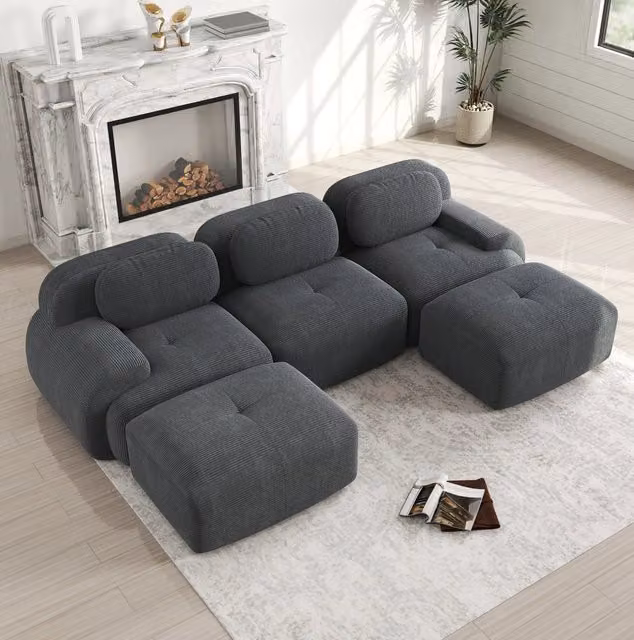 Divano angolare modulare in velluto a coste grigio; design senza struttura e base antiscivolo