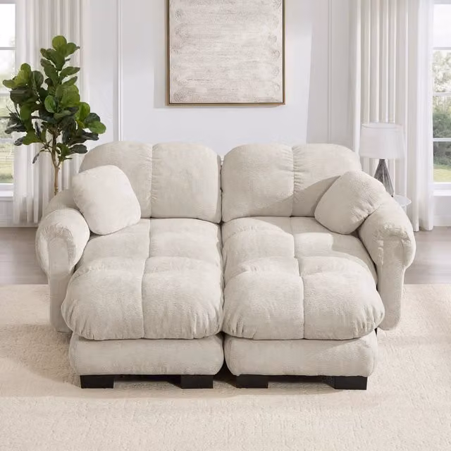 Divano panoramico modulare MIVRAY in tessuto beige con pouf coordinato e cuscini, configurabile a U o L, design moderno e reversibile