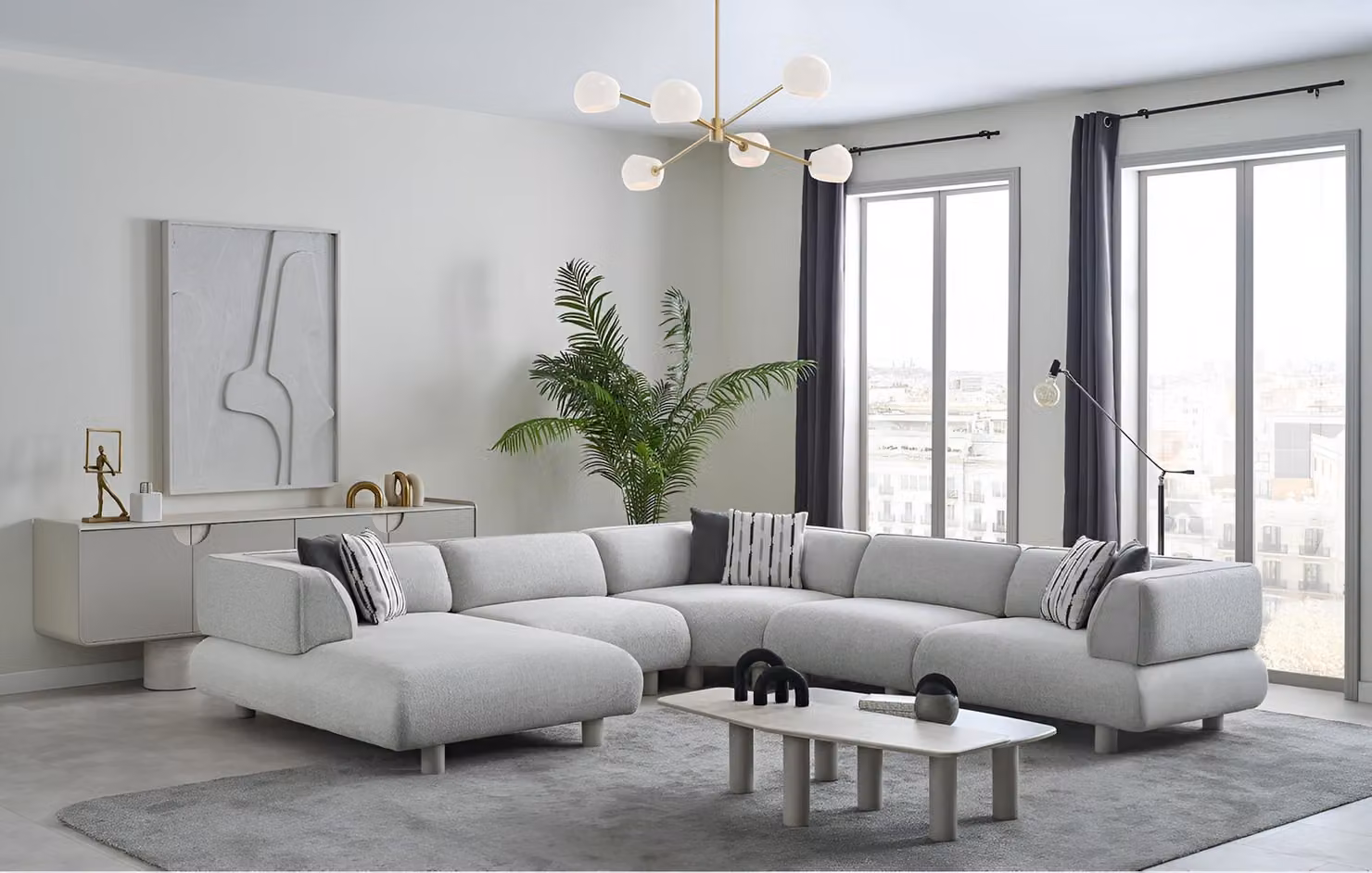 Set da salotto lussuoso e moderno, bianco, con divano ad angolo imbottito e tavolini da salotto