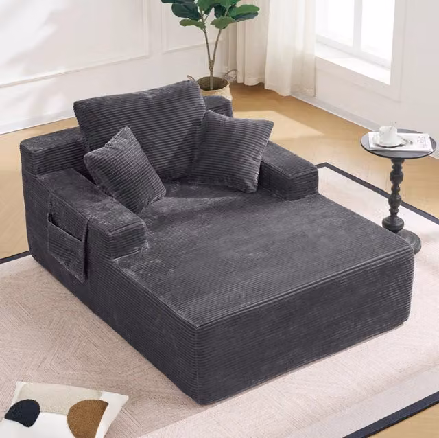 Divano da relax in tessuto a coste grigio scuro con tasche laterali HOMVRA