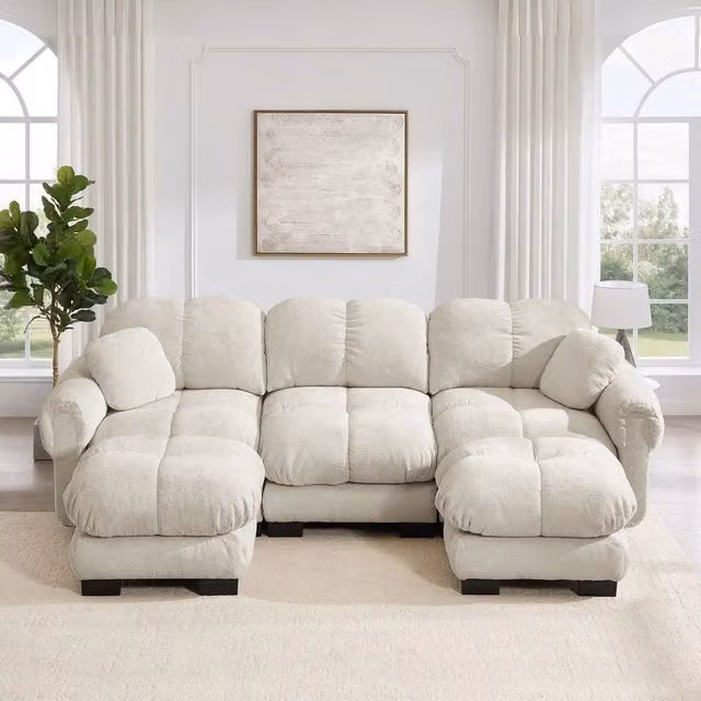 Divano 3 posti Minimal con poggiapiedi e cuscini trapuntati in tessuto beige chiaro – 1