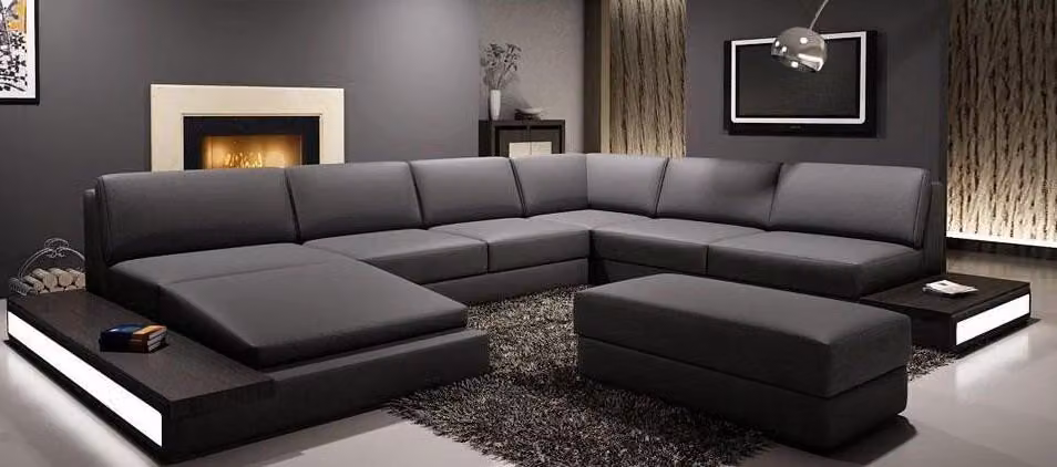 Divano angolare moderno, rivestito in pelle, design elegante, set di divani, soluzione d'arredo per il soggiorno, modello PHM102