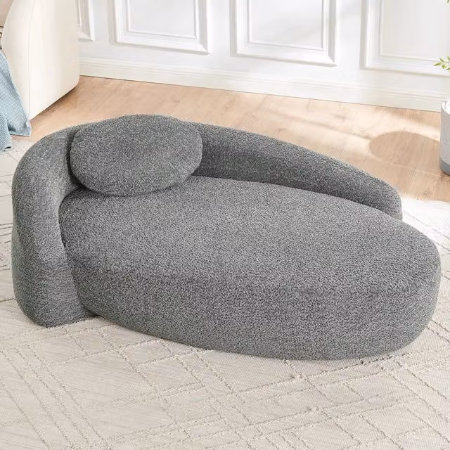 Divano compatto in tessuto teddy grigio scuro con design arrotondato