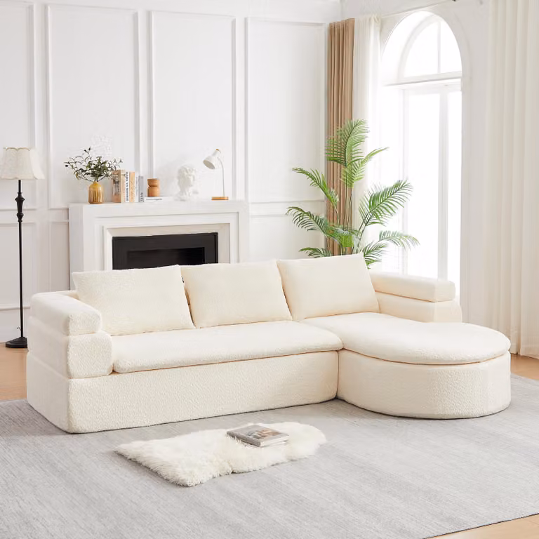 Divano angolare a forma di L, con chaise longue, rivestito in velluto, design "cloud", tre posti, superficie di riposo curva (beige)