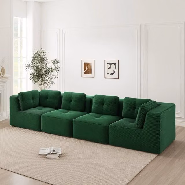 Divano angolare modulare senza montaggio con moduli flessibili seduta profonda e braccioli in velluto a coste verde