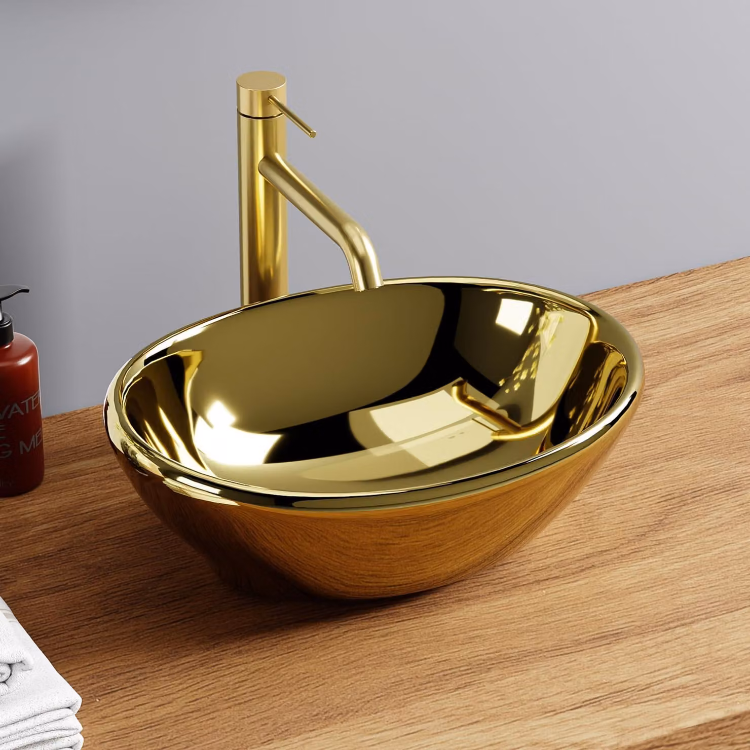 Lavabo ovale, finitura dorata lucida, dimensioni 41,5 x 33,5 x 14,5 cm