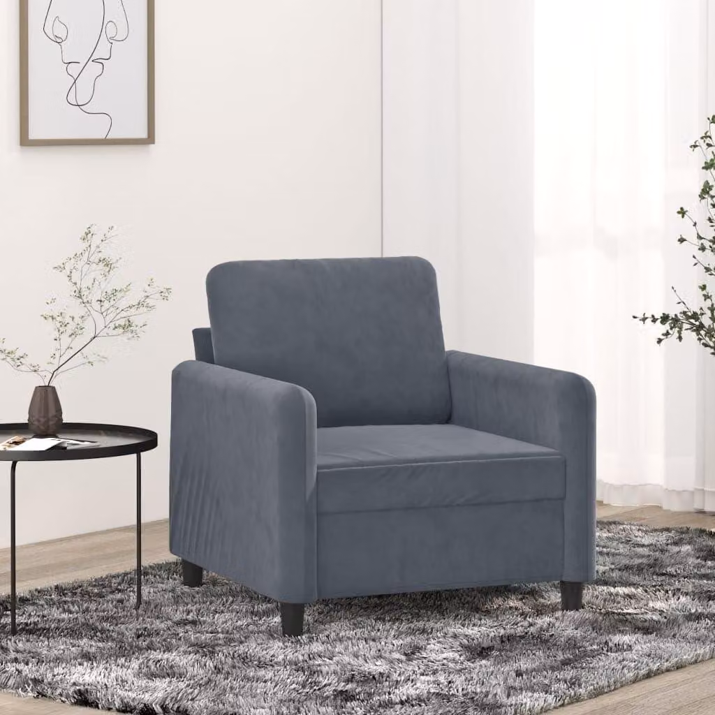 Poltrona di colore grigio scuro, altezza 60 cm, con rivestimento in velluto morbido e struttura in metallo robusta