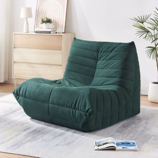 Poltrona bassa imbottita Kodsø en.casa in velluto a coste verde L 75 cm, P 90 cm, H 100 cm
