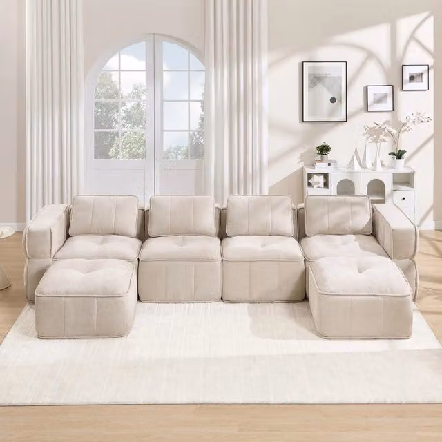 Divano modulare a U Minimal da 4 posti in tessuto beige con 2 poggiapiedi coordinati