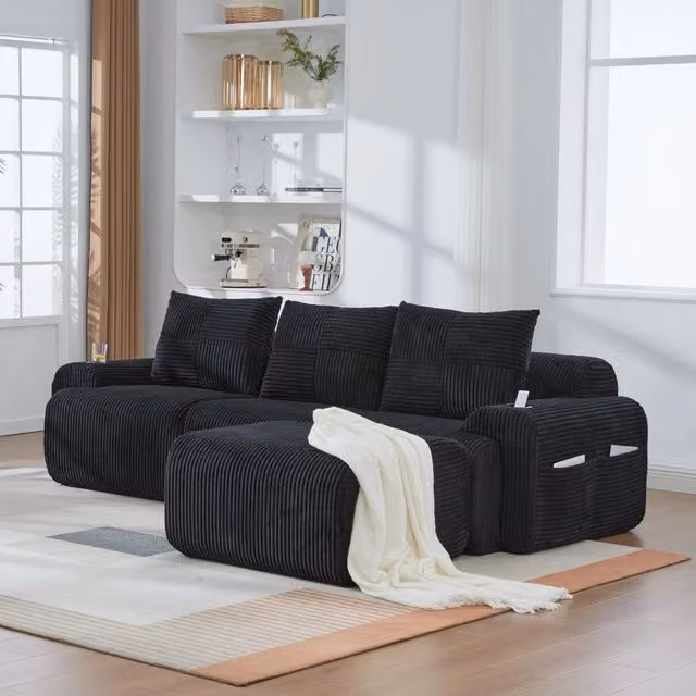 Divano modulare L-shape REDOM in velluto a coste nero con portabicchiere, L/P/H: 268 x 174 x 80 cm