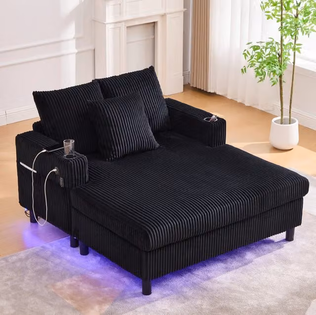 Poltrona relax oversize in velluto a coste nero con LED multicolore; USB e portabicchieri