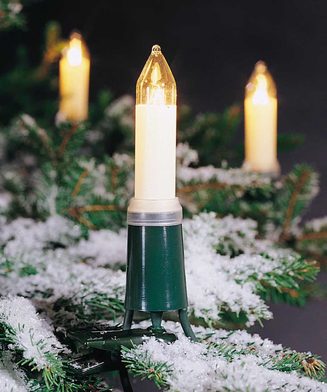 Konstsmide - Catena per alberi, candele ad albero, spina divisibile, 16 lampadine trasparenti, 230V, esterno, cavo verde ; 1131-000