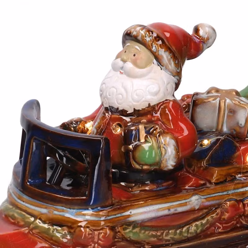 Statuetta Babbo Natale su macchina in ceramica VACCHETTI, colori rosso, bianco, verde e oro, L: 39 cm, P: 17 cm, H: 28 cm – 2
