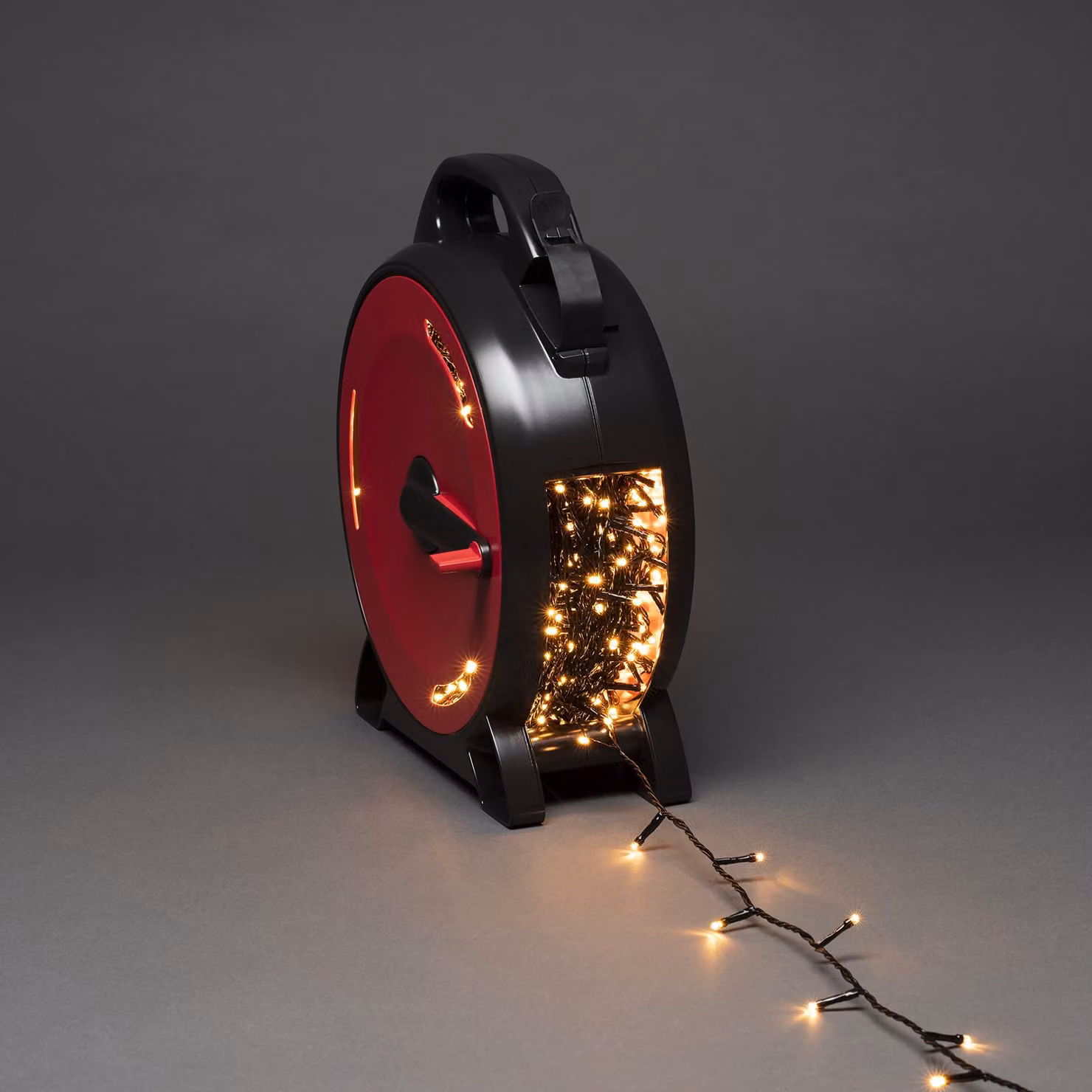 Konstsmide Micro LED con avvolgicavo, 1000 diodi color ambra, 30V, per esterni (IP44), cavo morbido nero - 3839-807