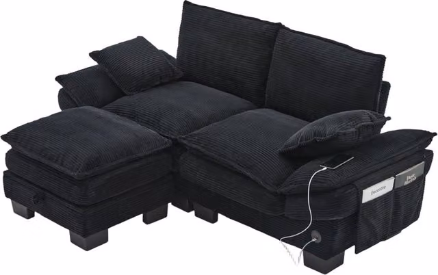 Divano modulare a L da 2 posti con pouf coordinato, ricarica USB e tasche laterali, rivestimento in velluto a coste nero. L/P/H: 190 x 132 x 84 cm – 1