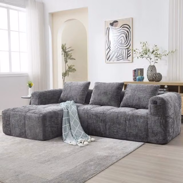 Divano angolare a L 3 posti senza montaggio con chaise longue; braccioli; 3 cuscini e tasca laterale; ciniglia; grigio
