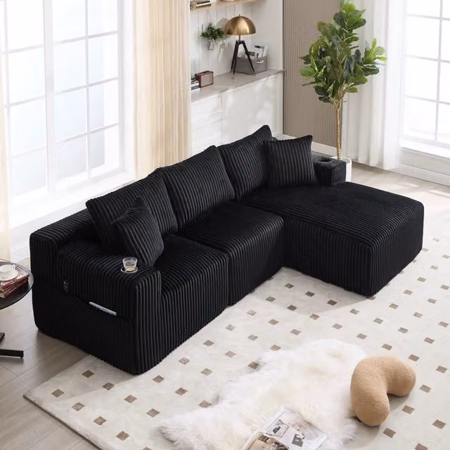 Divano angolare modulare Mivray in velluto a coste nero con chaise longue reversibile, portabicchieri e cuscini inclusi, L/P/H: 257 x 162 x 90 cm