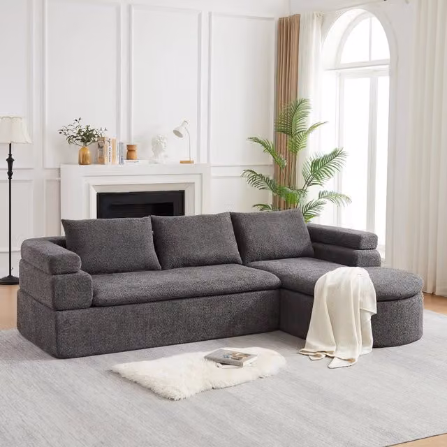 Divano angolare Mivray in tessuto grigio antracite con chaise longue e cuscini coordinati per il tuo soggiorno