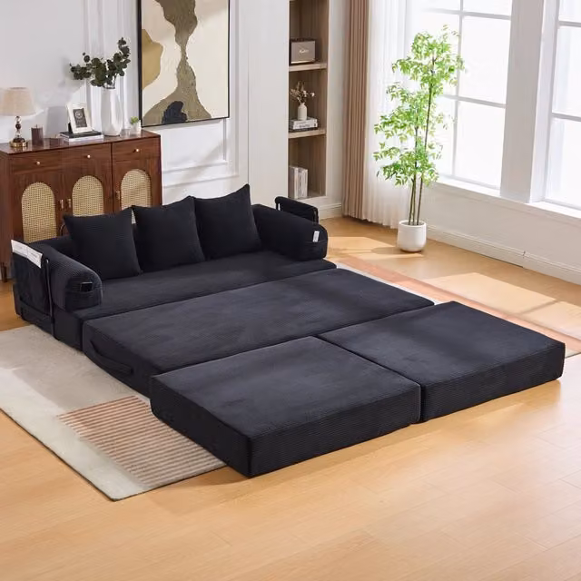 Divano modulare a L Mivray in velluto a coste nero con pouf coordinato e cuscini imbottiti, struttura in metallo