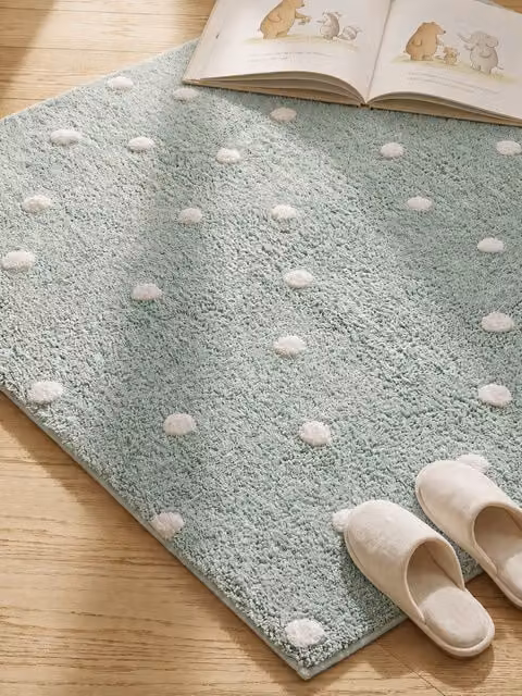 Tappeto rotondo a pois Dots in cotone color menta Kenay Home per cameretta bambini