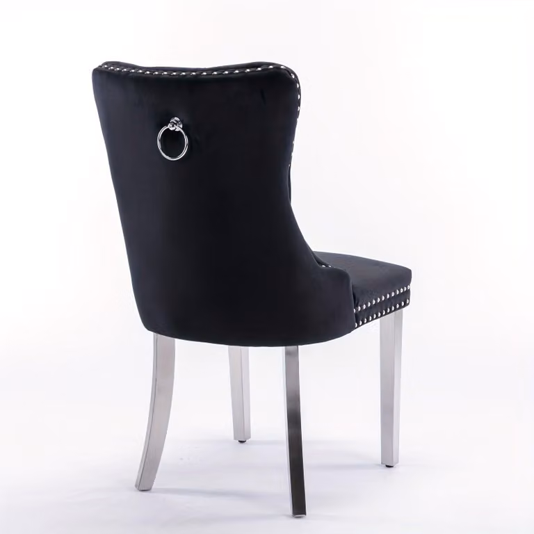 Set di due eleganti sedie da pranzo imbottite, dal design moderno e rivestite in tessuto capitoné, disponibili in un raffinato colore nero