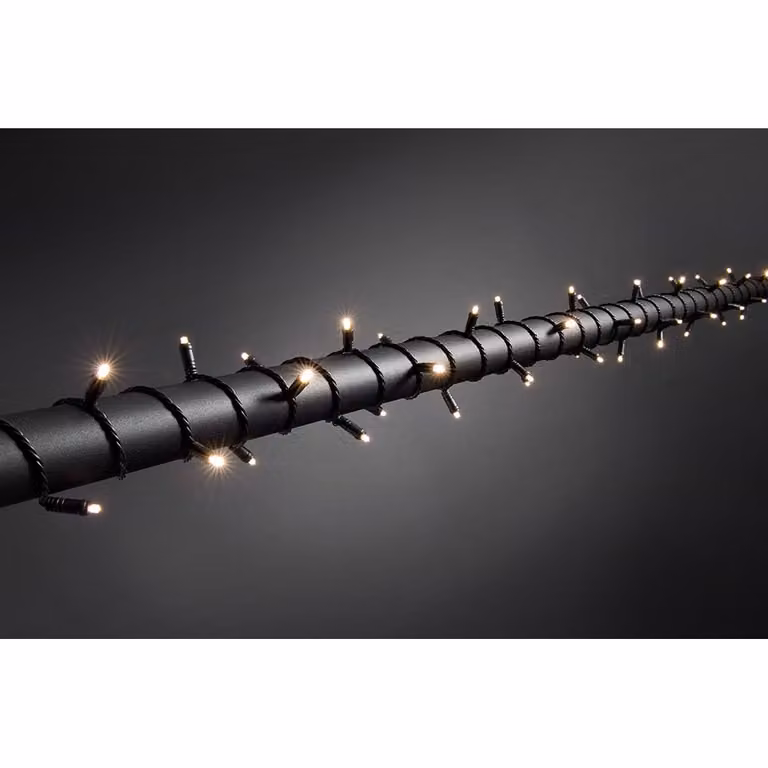 Konstsmide - Fata micro LED, con timer 9 ore, isolata/incapsulata, IP67, 80 diodi bianchi caldi, trasformatore da esterno 24V, cavo morbido nero ; 6631-117