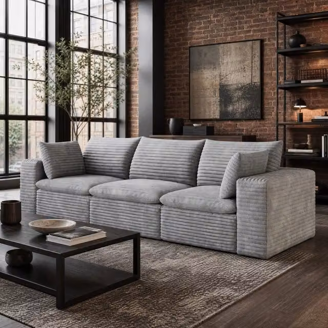 Divano modulare in tessuto grigio con imbottitura in schiuma e design senza struttura in legno