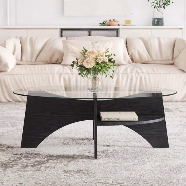 Tavolino moderno ovale WISHDOR in vetro di sicurezza trasparente e MDF effetto legno nero, L: 104,9 cm, P: 60 cm, H: 35,6 cm