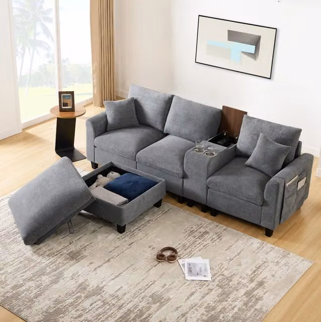Divano angolare modulare 4 posti in tessuto corduroy grigio con consolle USB e pouf contenitore