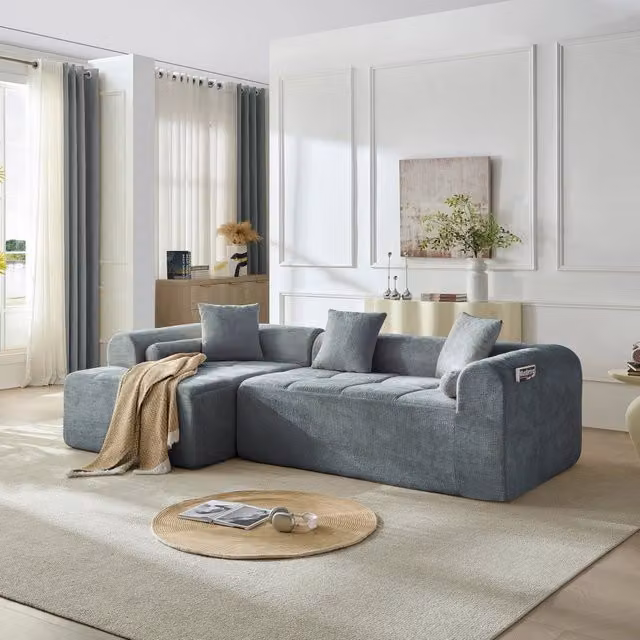 Divano angolare con seduta in schiuma ad alta densità e molle; rivestimento in ciniglia blu