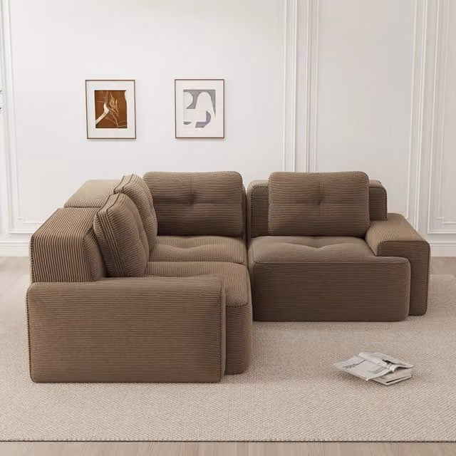 Divano angolare modulare Mivray in velluto a coste marrone con design moderno e struttura imbottita