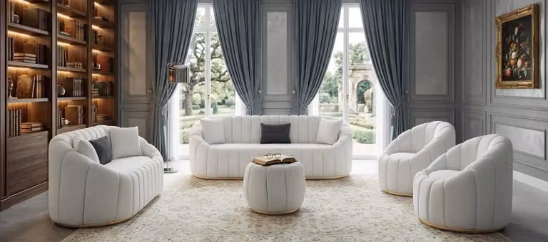 Divano e poltrona imbottiti, bianchi e a righe, dal design elegante