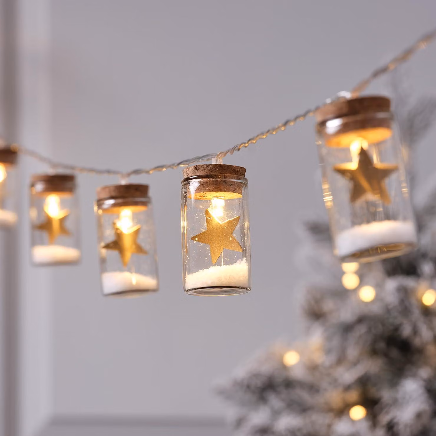 Catena luminosa a forma di stella, realizzata in vetro, con 10 LED bianco caldo, color oro, lunghezza 135 cm