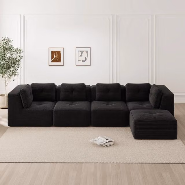 Divano angolare modulare Mivray in velluto nero con funzione letto e seduta profonda