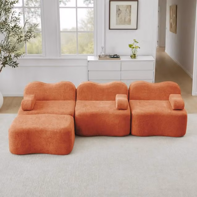 Divano angolare modulare senza struttura interna con pouf; schiuma 32D e rivestimento in velluto; arancione